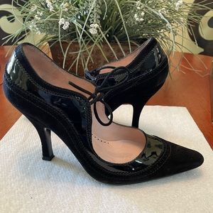 Delman black suede and black Paton leather heels.